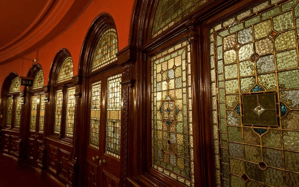 The stained glass windows of the stalls bar.