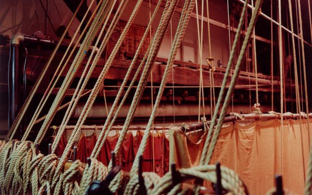 Flies Rows of flies (ropes for moving set) backstage of the theatre