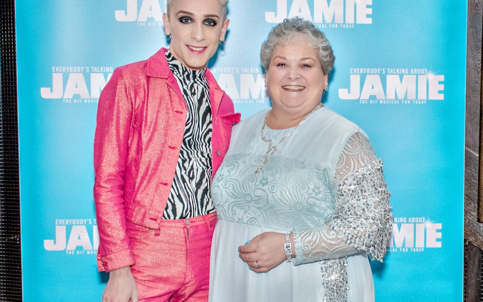 ETAJ. Jamie and Margaret Campbell. Credit Ant Robling Jamie and Margaret Campbell stand together in front of the Everybody's Talking About Jamie blue background