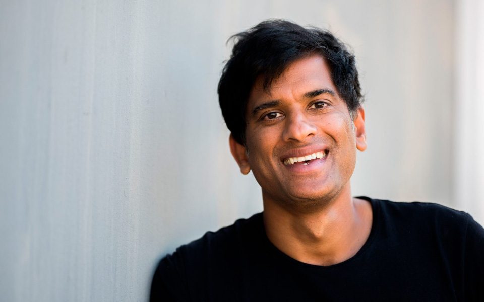 Dr Rangan Chatterjee Dr Rangan Chatterjee smiling against a white wall