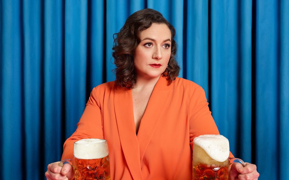 Jessica Fostekew with two big pints of beer