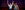 Kevin Clay, Thomas Vernal in The Book of Mormon Kevin Clay in a white shirt and black tie holds hands in the air with Kevin Clay dressed in camouflage