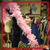 Imogen - Learning - Feather Boa Imogen, Learning and Education Administrator, holding up a pink feather boa and scowling
