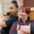 Imogen Hinchcliffe and LAIT member Imogen Hinchcliffe and a LAIT member posing with arms crossed in a workshop