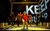 The Curious Incident of the Dog in the Night-Time A boy in a red hoodie stands at the front of the stage surrounded by people