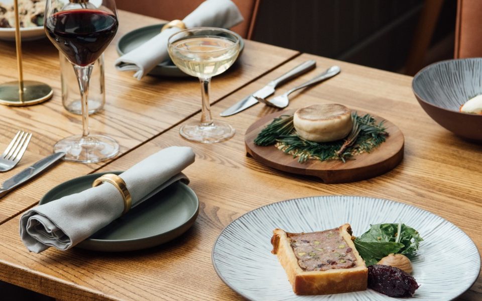 Wooden table laid with tasty looking <a href=