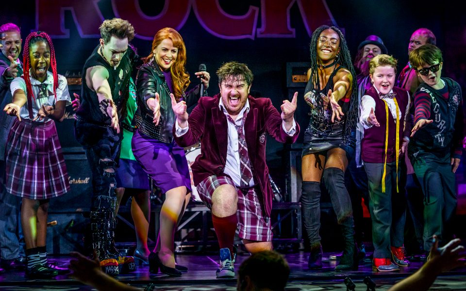 The cast of School of Rock on stage