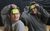 Sarah Jarrett in LAIT Two people in grey jumpers holding sticky notes on the foreheads
