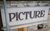 HPPH Facade Tiles CLose up of facade tiles reading 'picture' with scaffolding