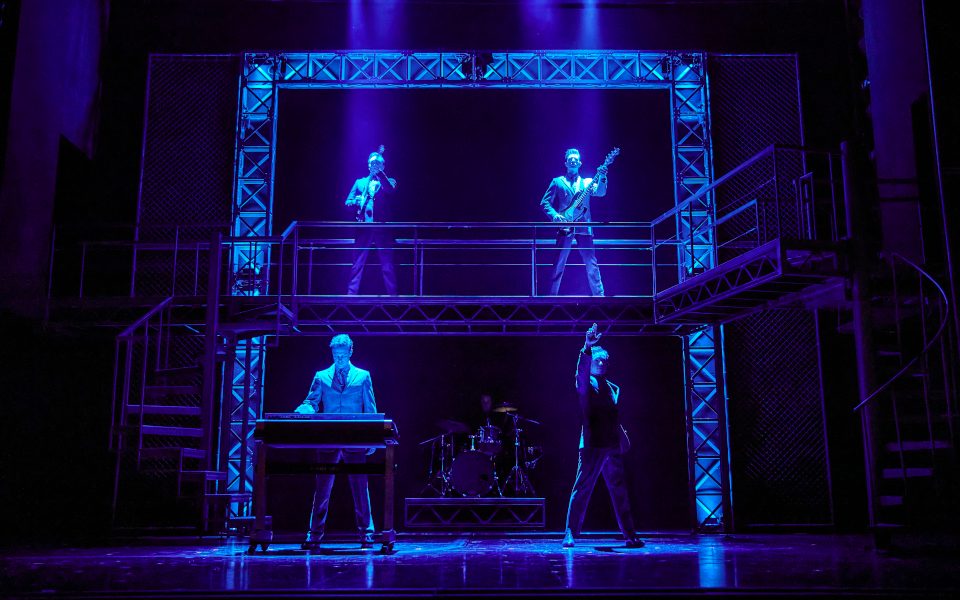 Blue lighting on the actors playing the four seasons