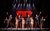 Jersey Boys Production Image The Jersey Boys cast on stage with their arms in the air