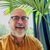 Robb Barham 1080x1080 Robb Barham in glasses and an orange shirt with a green plant behind