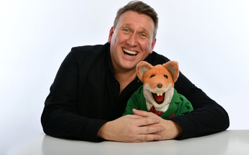 Mr Martin with his arms around Basil Brush