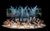 Members of the company in Chichester Festival Theatre’s production of SOUTH PACIFIC Photo Johan Persson_55006 Members of the South Pacific company on stage with stage light beams coming down towards them