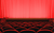 Interior of HPPH Rows of red cinema chairs in front of red curtains