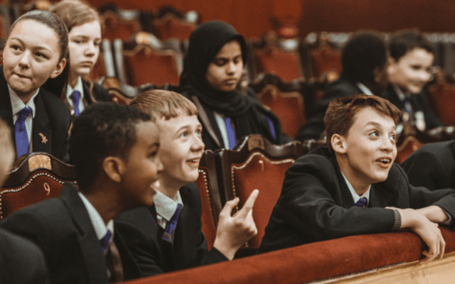 Leeds Trinity Academy at City Varieties A group of young people in uniform in the auditorium of City Varieties