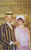 Maureen Kershaw in The Boy Friend A man in a pin-striped suit and straw boater with a woman in pink 1920s style clothes