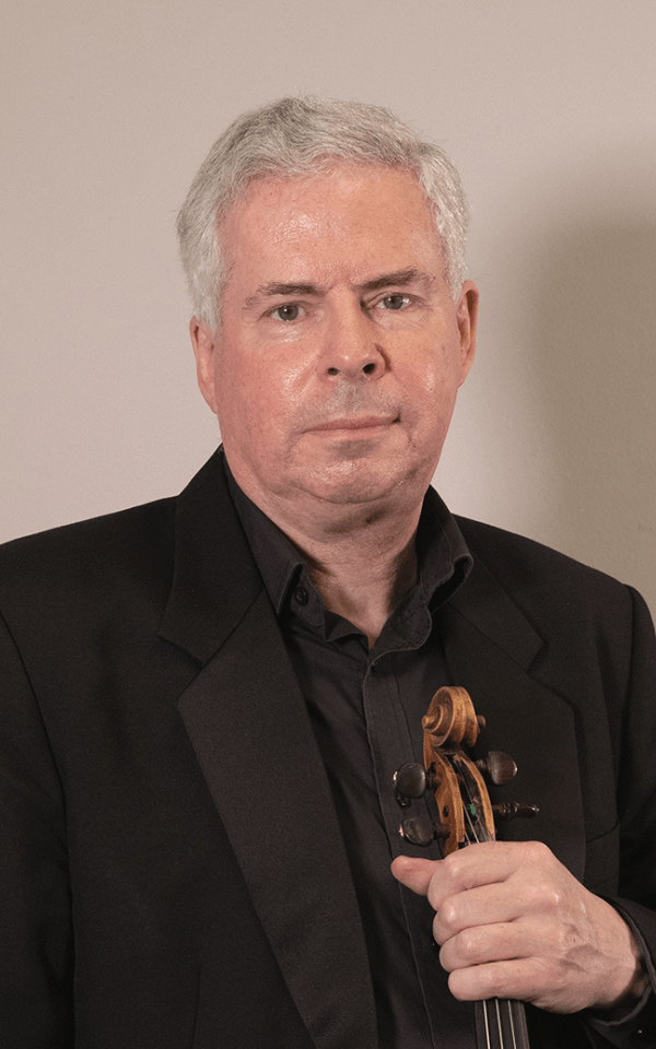 A headshot of Geoff Allan holding a violin