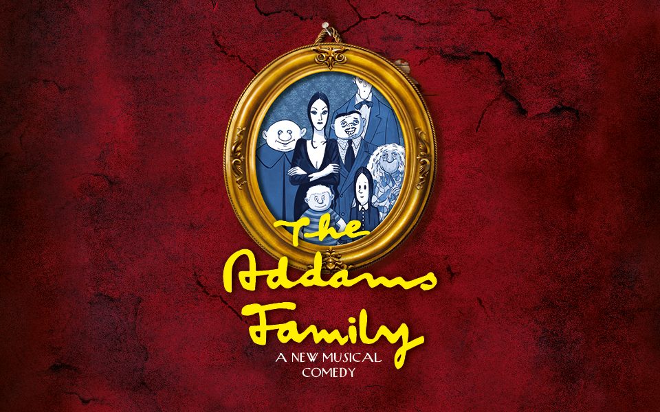 The Addams Family in a picture frame on a red wall