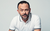 Geoff Norcott. Credit Karla Gowlett. Geoff Norcott wears a white polo shirt in front of a white background.