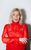 Sara Pascoe Sara Pascoe smiling wearing a red suit outfit and red lipstick