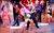 Strictly Ballroom A man and woman in a ballroom dance hold with backing dances around them