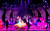 Strictly Ballroom Dancers in a pink-lit ballroom