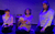Holocaust Memorial Day 2022 Three women kneeling on the floor in blue lighting. The middle one holds a baby.