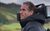 Gordon Buchanan Gordon Buchanan in front of a large video camera staring out at the green hilly landscape