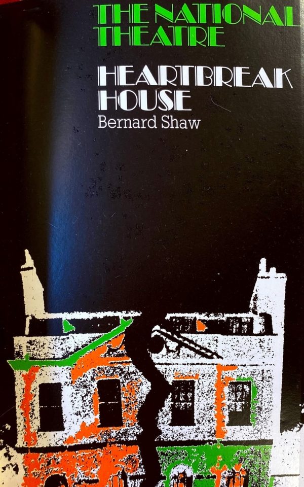 The poster for The National Theatre production of Heartbreak House at Leeds Grand Theatre in 1975. The poster is black with a orange, green and white drawing of a house with a crack down the middle