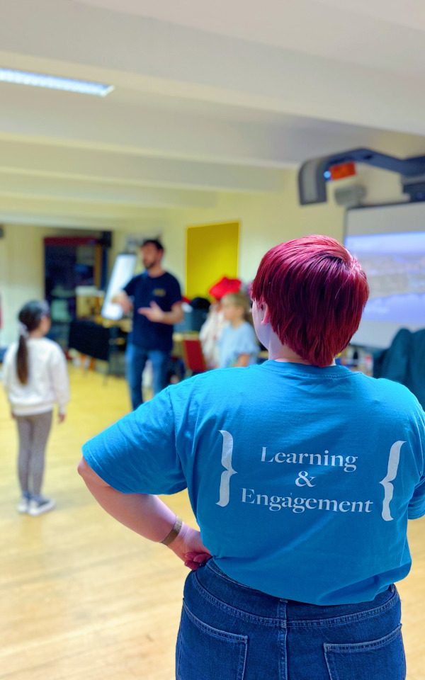 A member of the Learning and Engagement team observes a workshop. Credit: Aaron Cawood