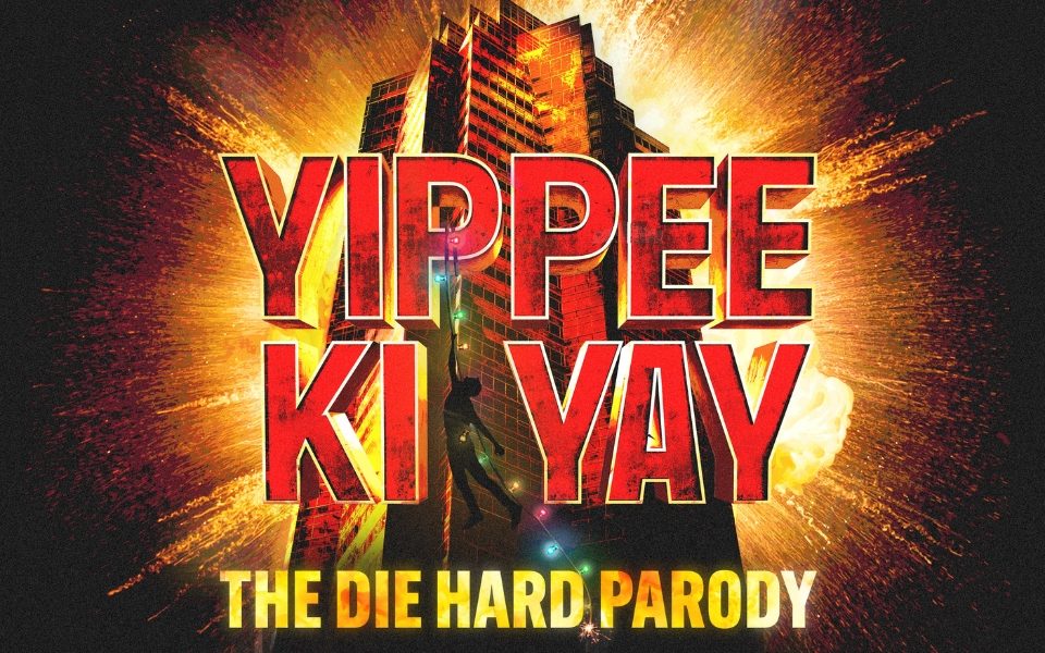 Yippe Ki Yay is written in bold red letters and The Die Hard Parody is written in bold yellow letters underneath. A man is hanging from a strand of lights coming off a skyscraper.
