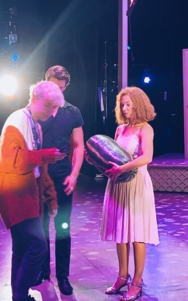 Aaron instructs Dirty Dancing cast members during a photo call.