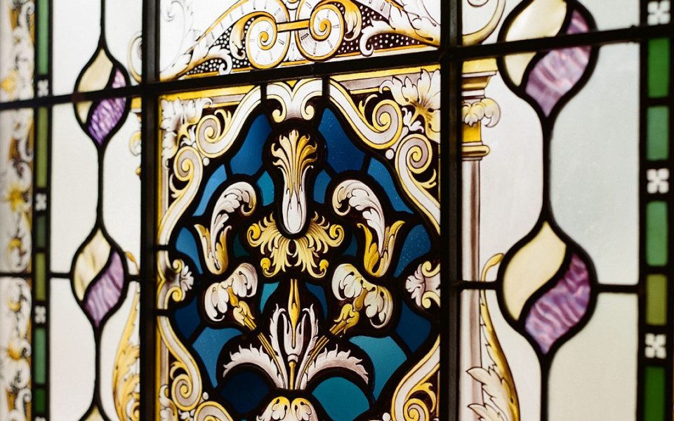 An image of a stained glass window with bright colours taken at Hyde Park.