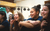 Young people smiling. Credit Chris Coote A group of secondary-age children sitting on the floor and smiling as they listen to someone past the camera