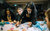 Students at desk. Credit Chris Werrett A group of secondary schoolchildren gather around a desk and draw on their production moodboard