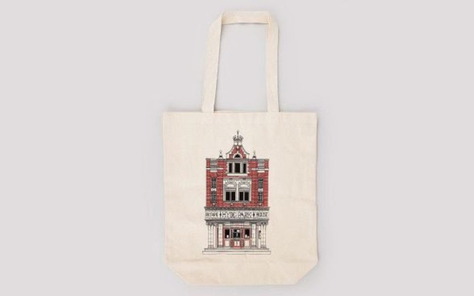 A tote bag with a picture of Hyde Park Picture House on it. The tot bag is white.