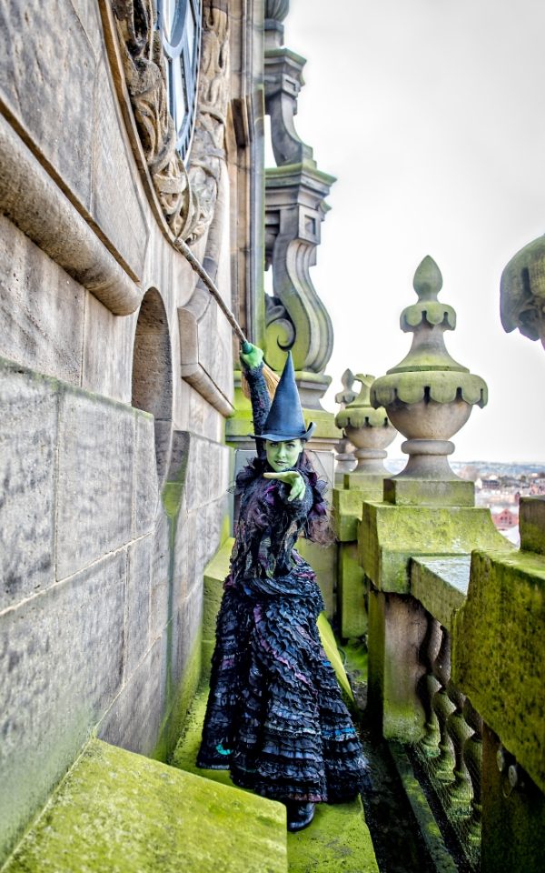Elphaba from Wicked on top of the Leeds Town Hall building