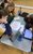 Students complete a desk task. Students work together around paper and iPads on a desk.