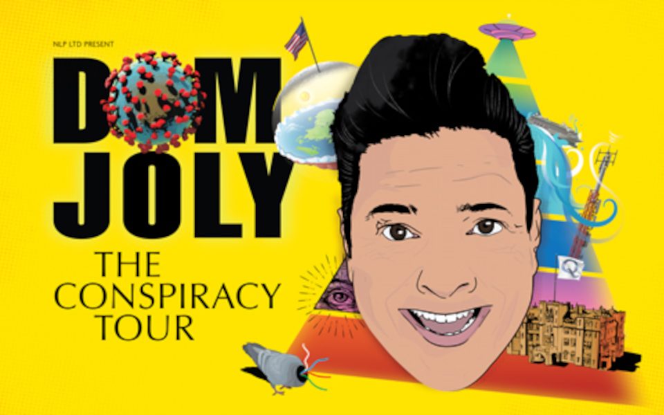 The text reads Dom Joly: The Conspiracy Tour. A cartoon of Dom sits in front of a pyramid with a UFO, flat earth, and a surveillance pigeon.