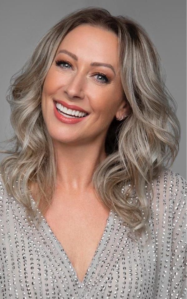 Portrait of Faye Tozer smiling at the camera