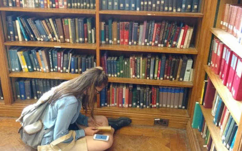 Kate sat cross-legged on the floor of the Brotherton library, looking through books