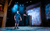Addams Family 2023 A stage manager with a headset on stands on stage at City Varieties with a shadow behind him