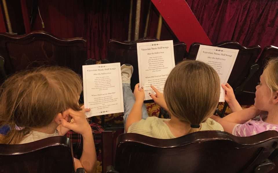 Young people learn Victorian music hall songs.