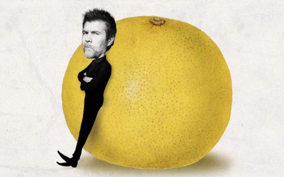 Rhod Gilbert is leaning against a Giant Grapefruit.