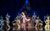 The King and I Dancers in The King and I in traditional Thai costumes in formation on the stage.