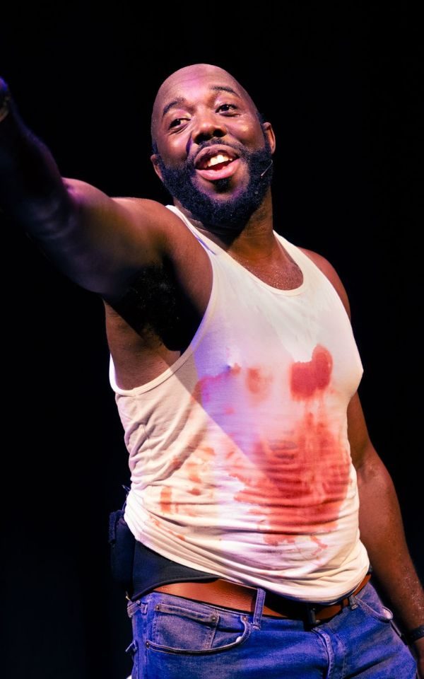 Darrel Bailey in Yippee Ki Yay, wearing a blood stained vest. Credit: Steve Ullathorne