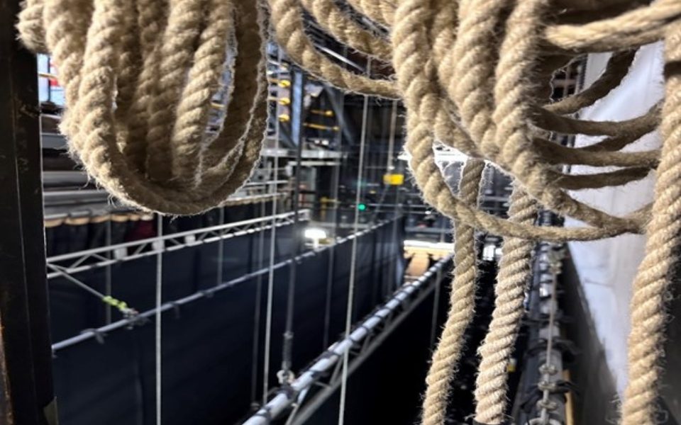 Lots of ropes above the black tabs on stage.