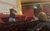 Talk from Head of Stage The Head of Stage standing in front of students seated in the City Varieties auditorium holding up a tool and giving a talk.