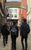 Technical Theatre students Three students with their backs to the camera walking towards City Varieties under the green and red arched sign.